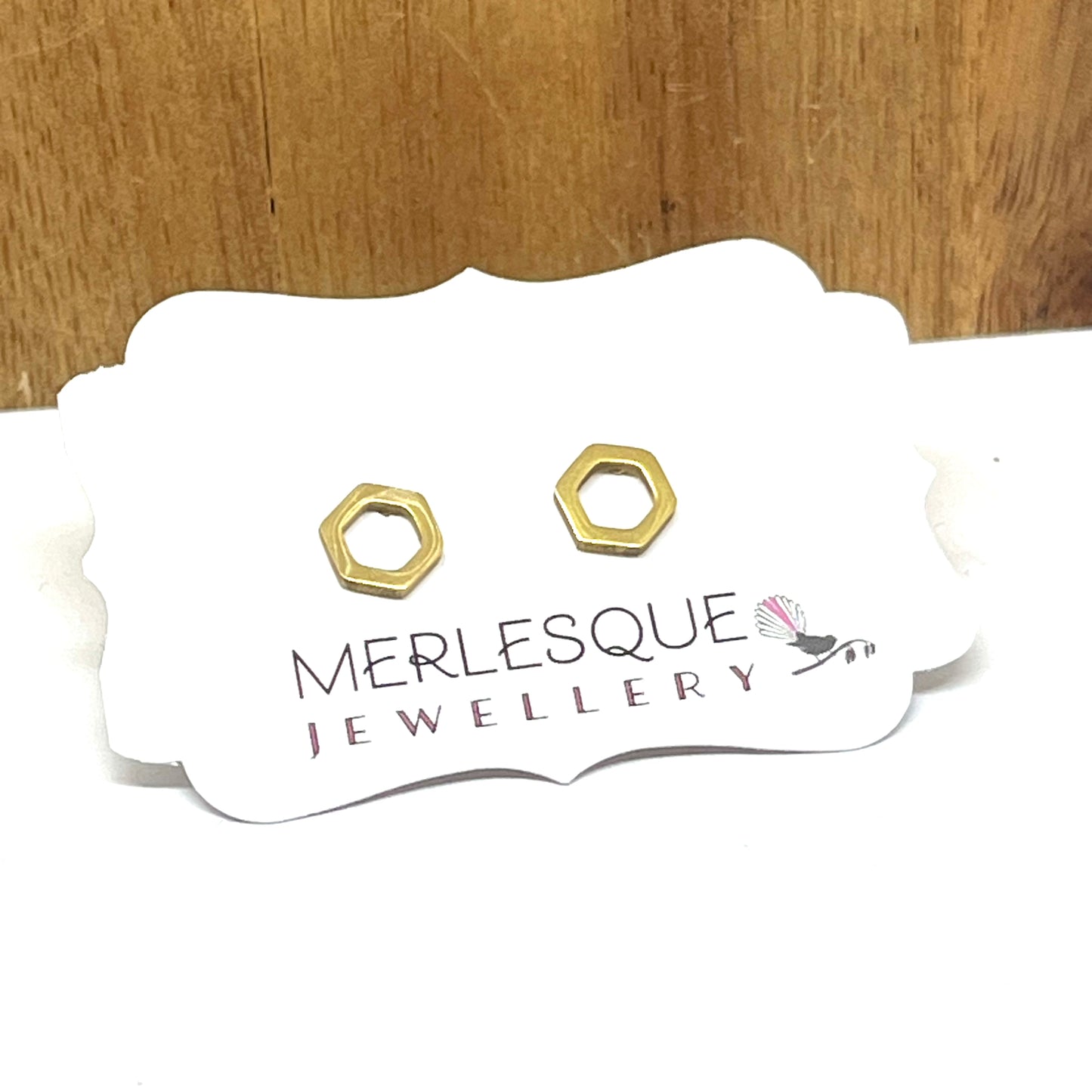 Stainless steel gold hexagon studs.