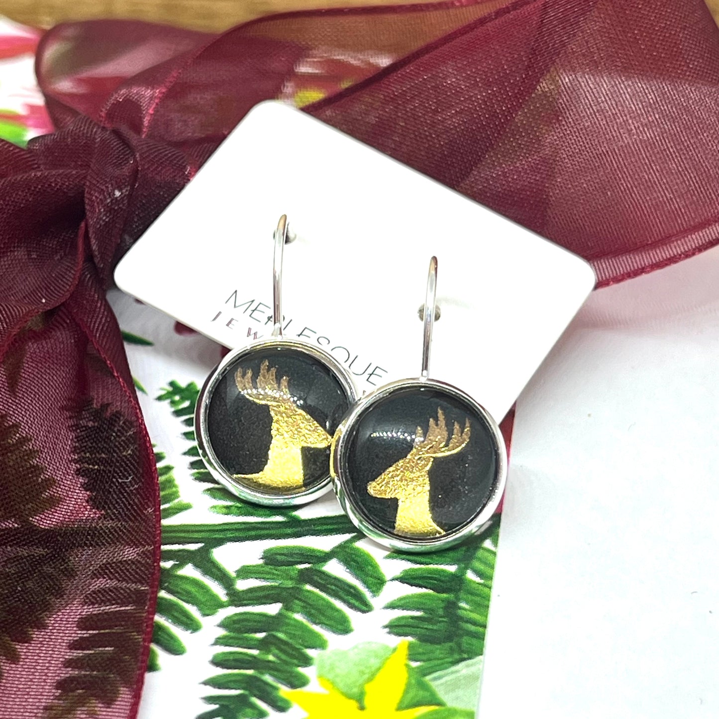 Black and gold glass dome reindeer christmas earrings