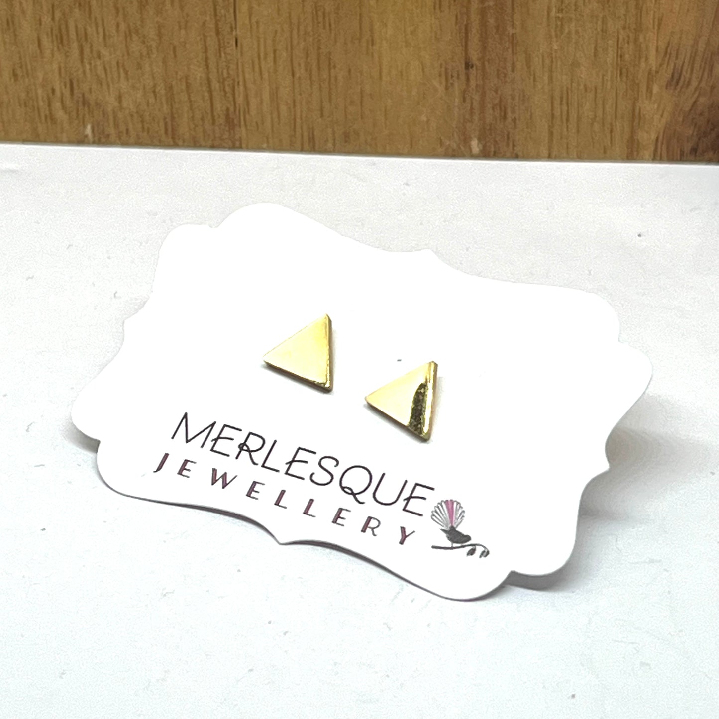 Stainless steel gold triangle studs.