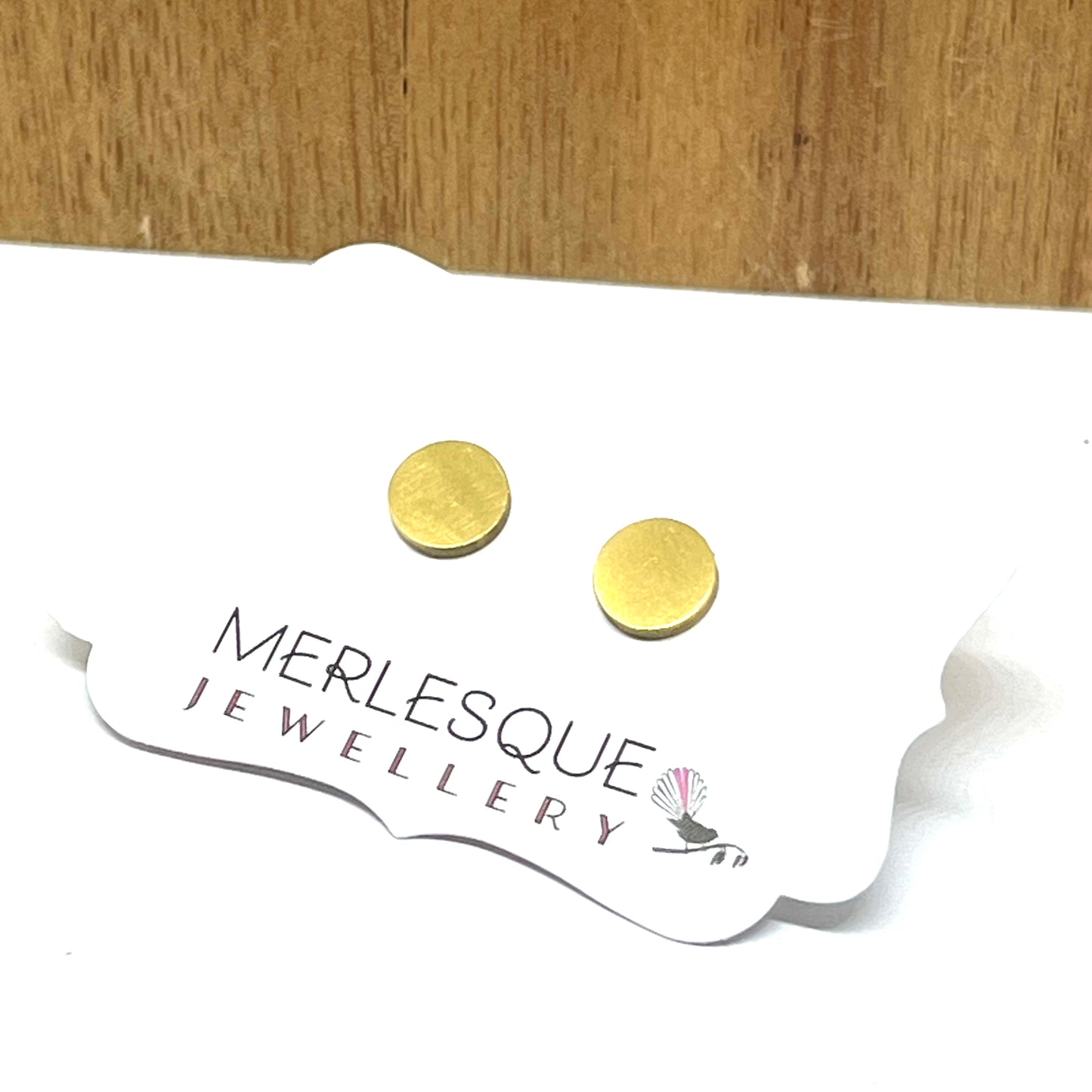 Stainless steel gold circle studs.