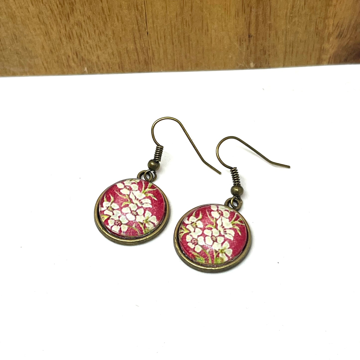 Manuka stamp image on short bonze earring hooks