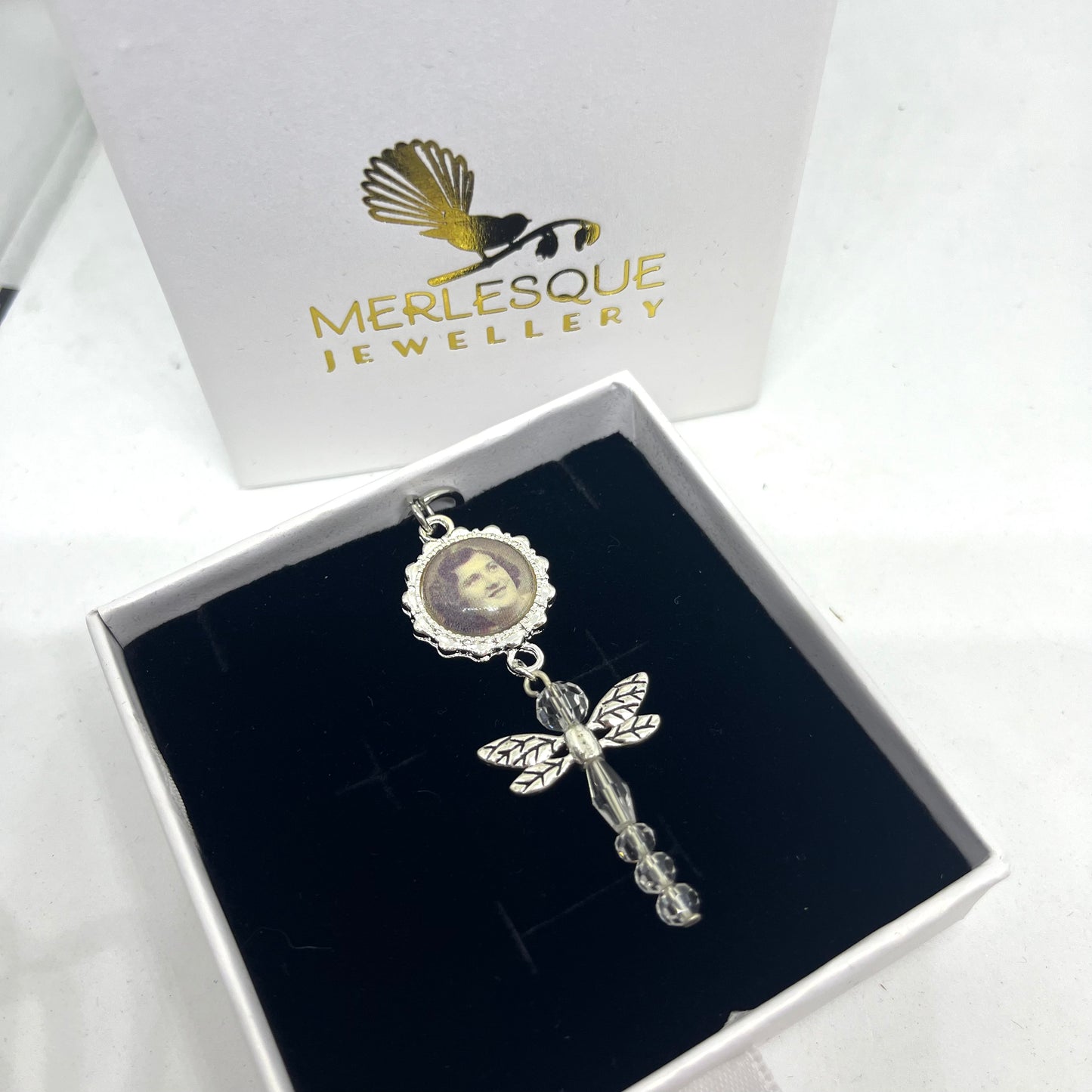 Silver and glass dragonfly pendant with a photo set under glass