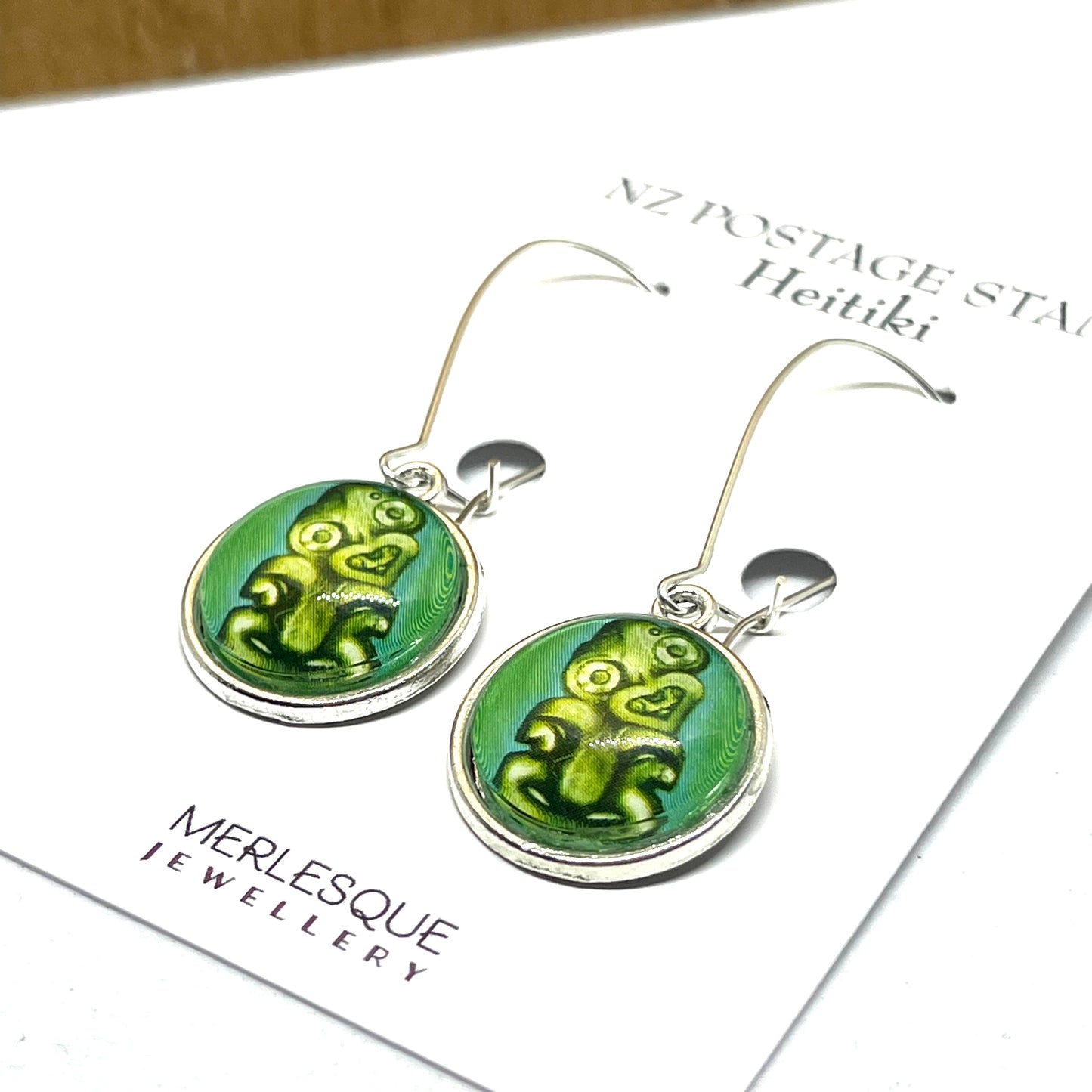 Hei tiki stamp image on long silver earring hooks