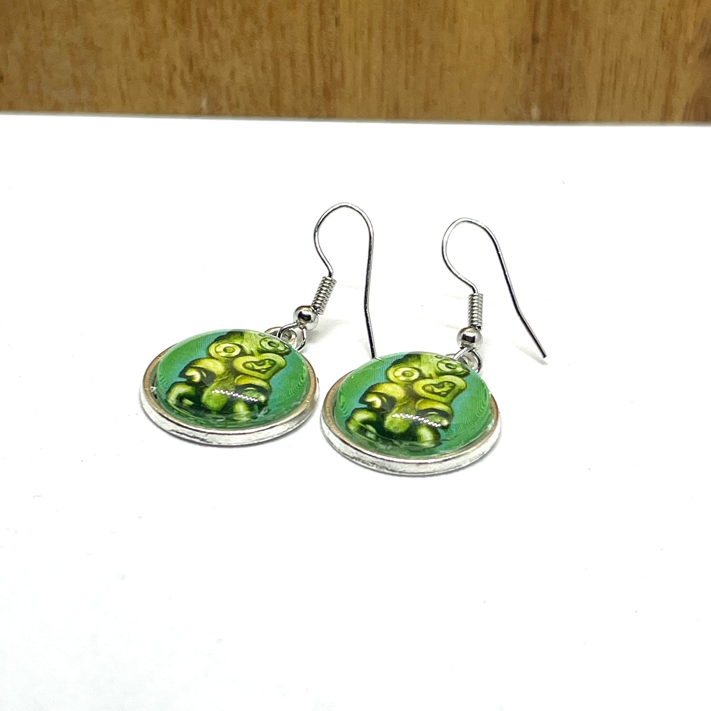 Hei tiki stamp image on short silver earring hooks