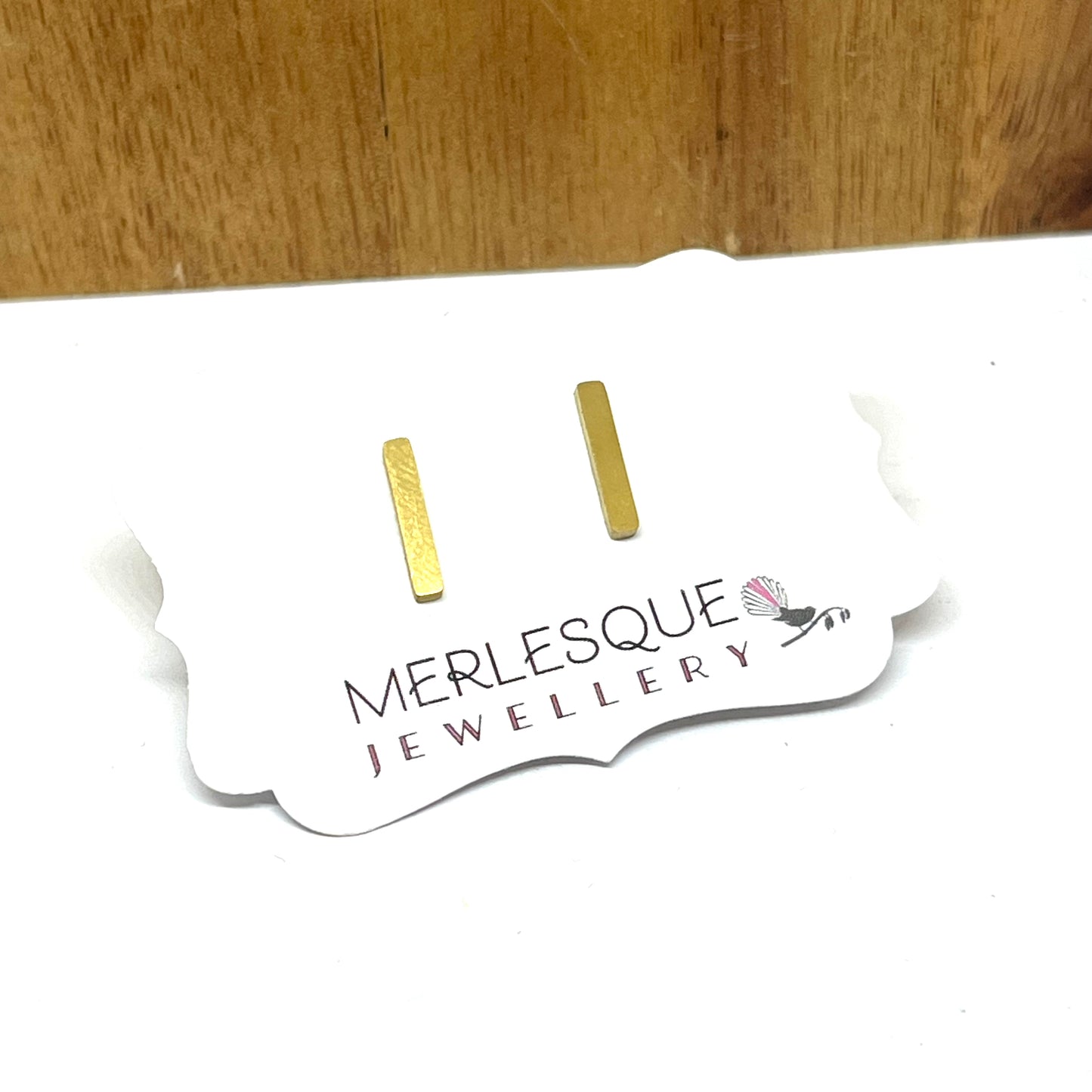 Stainless steel gold bar studs.