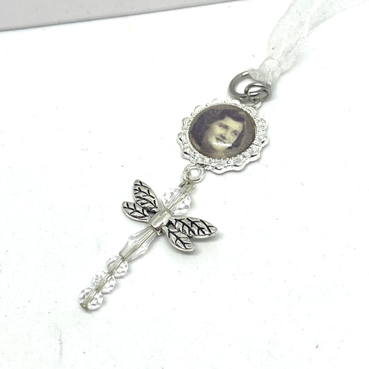 Glass Dragonfly hung on a silver setting with a photo set under glass