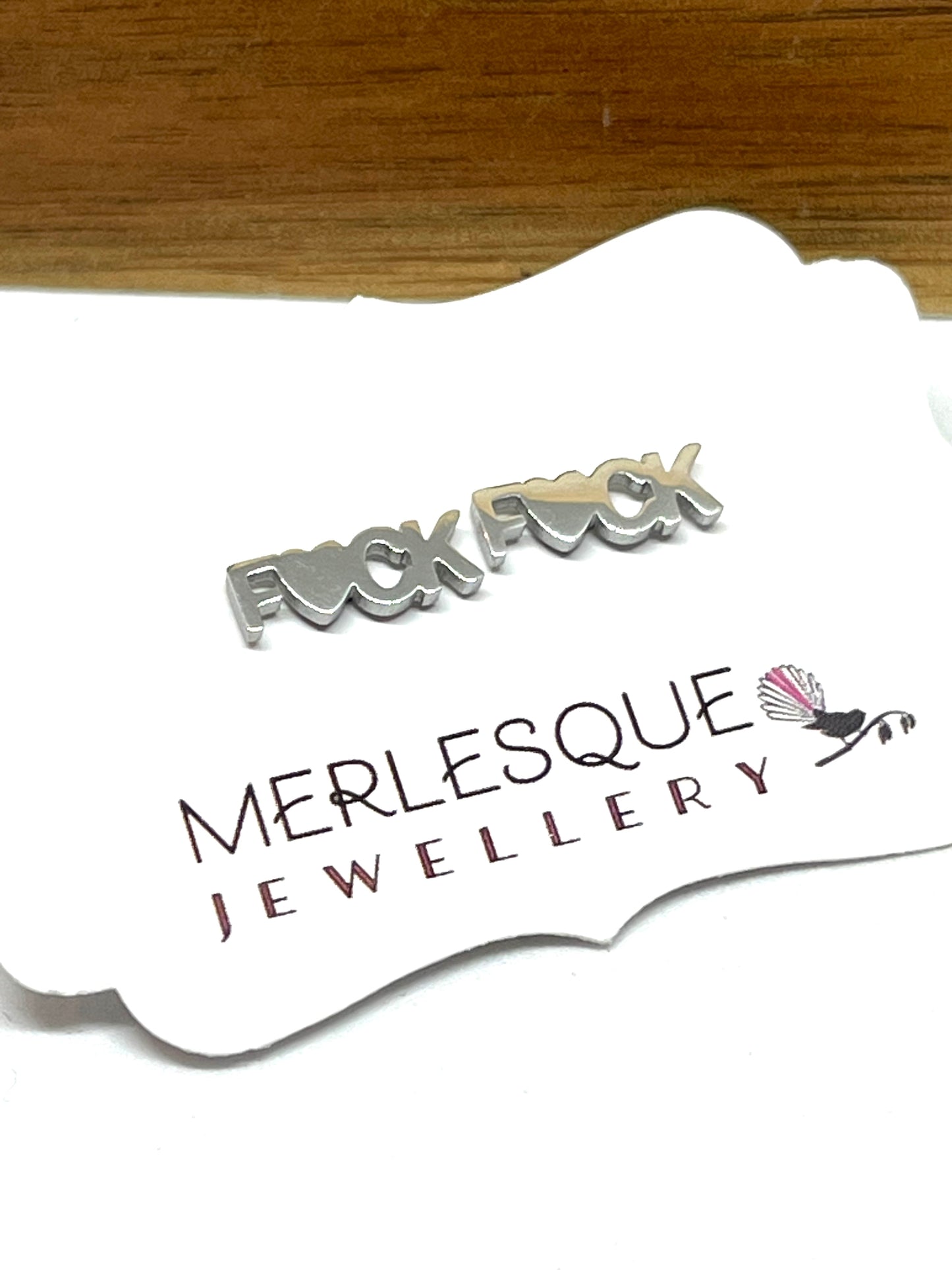 silver fuck stud earrings