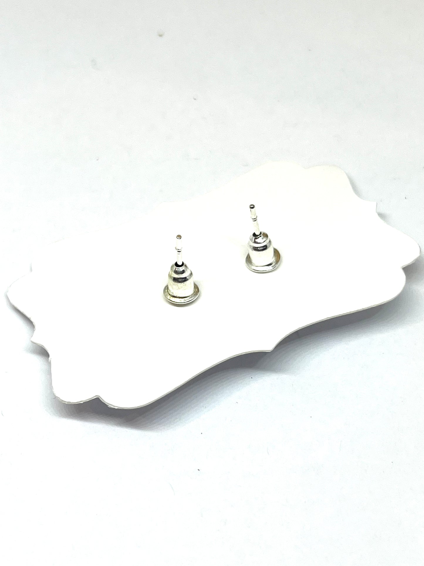 BLACK AND WHITE CROSS STUDS