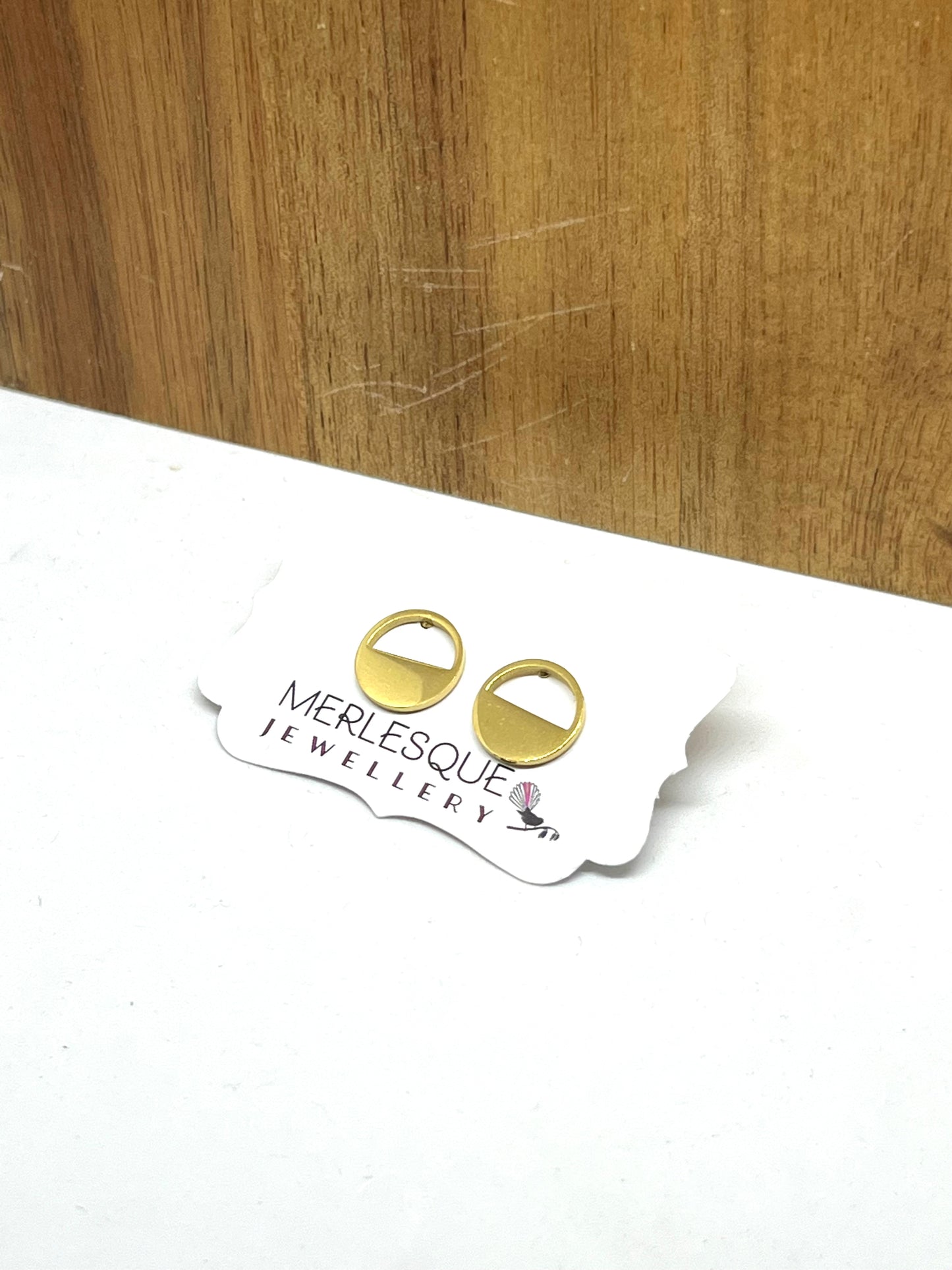 Stainless steel gold half circle studs.