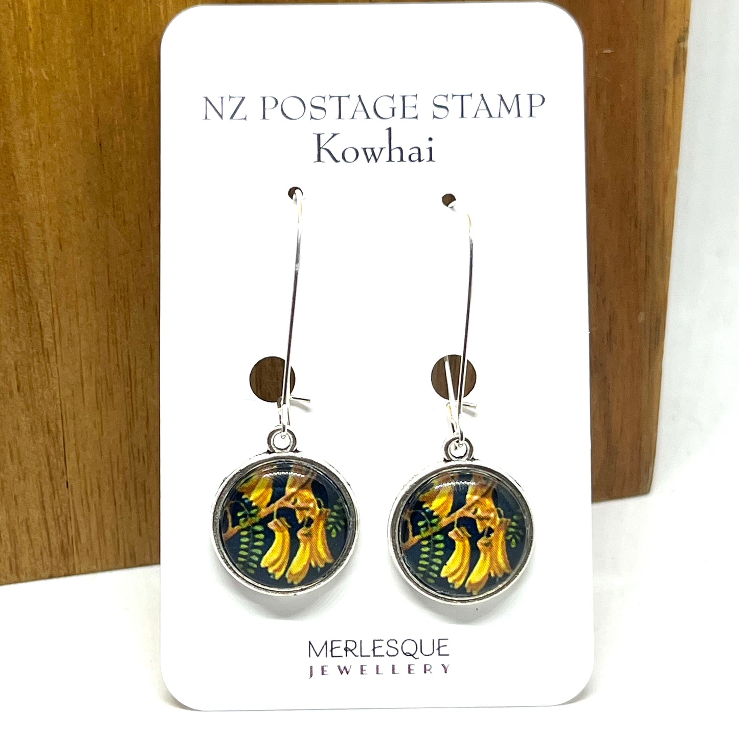 Kowhai stamp image on long silver earring hooks