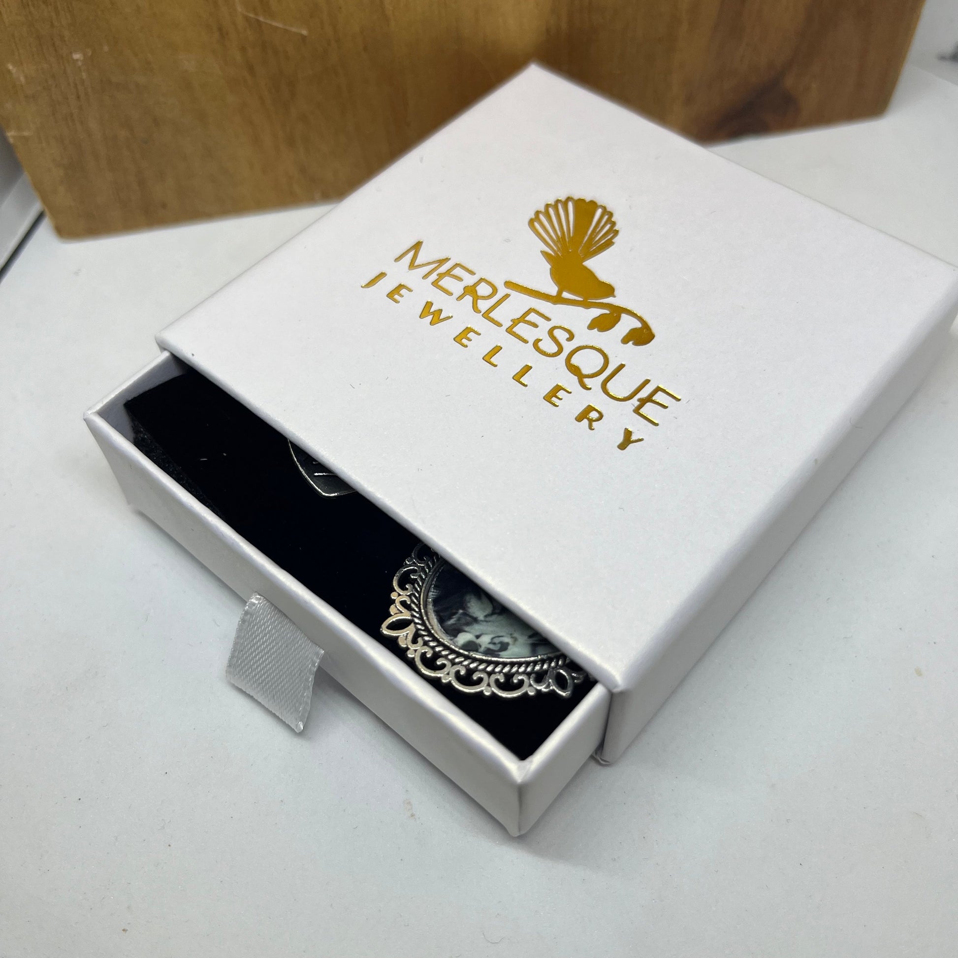 Gold and white wedding box for a bouquet charm.