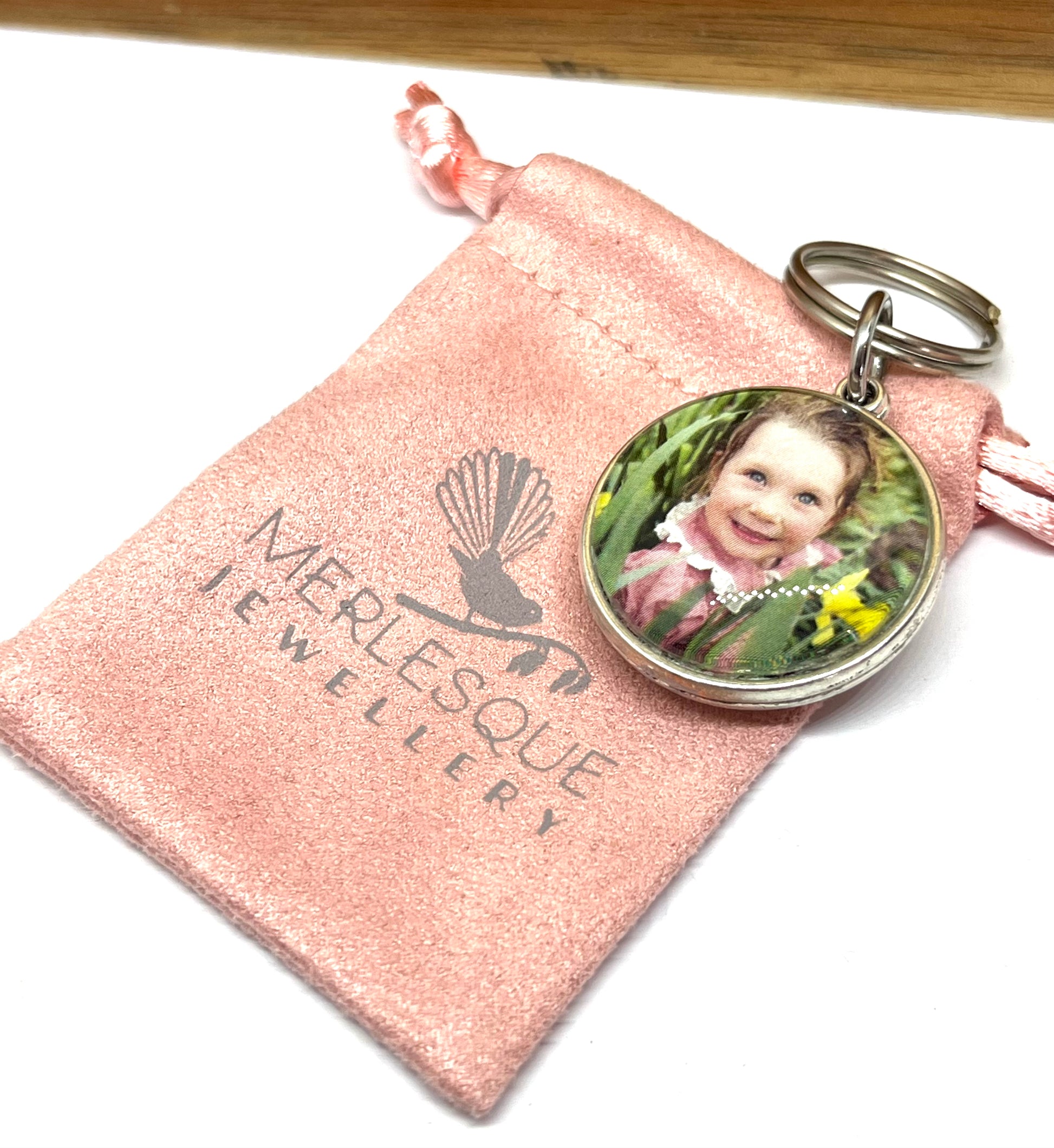 Photo keyring in a silver setting.