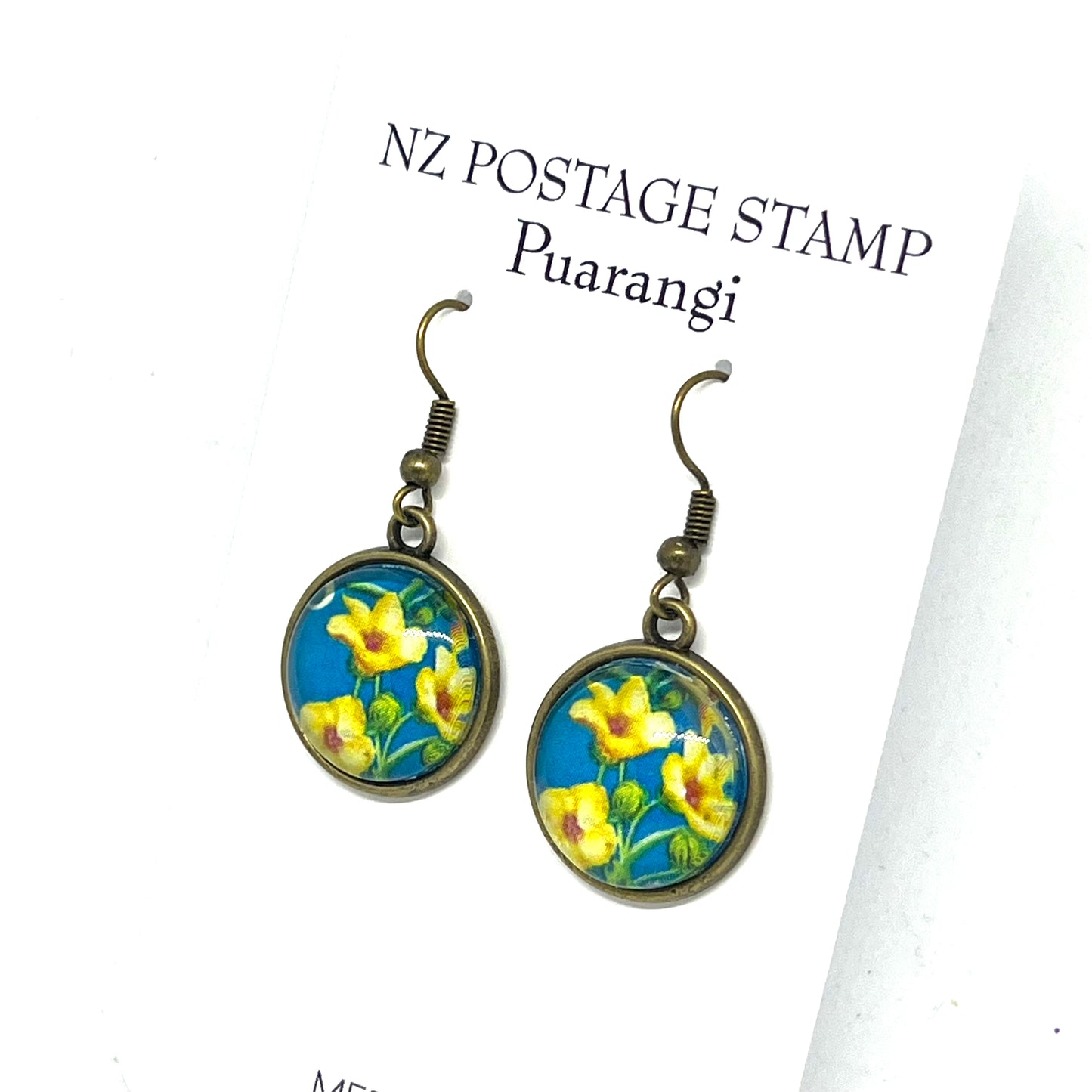 Puarangi (hibiscus) flower stamp encased in a bronze setting on nickel free hooks