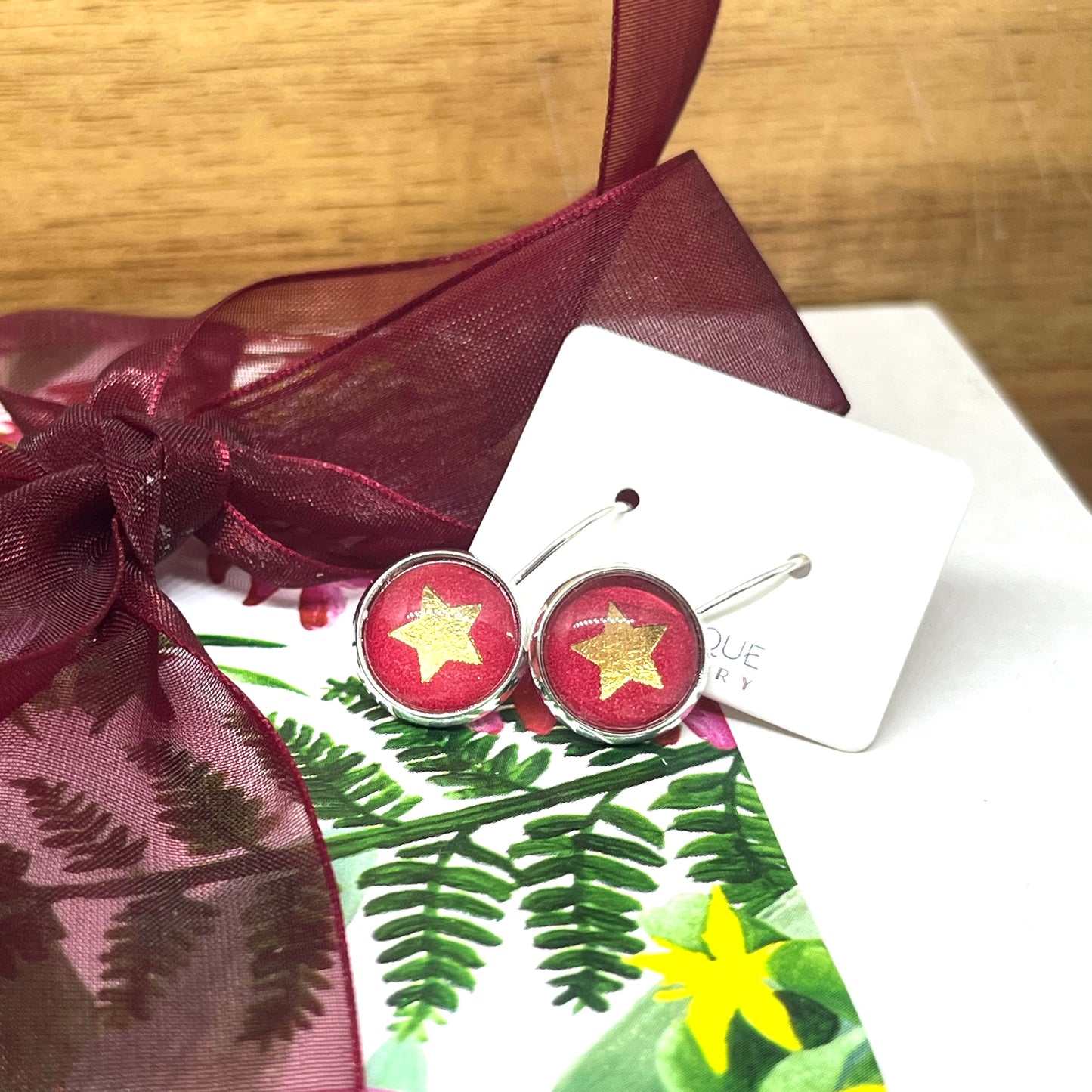 Red & Gold star glass dome christmas earrings 