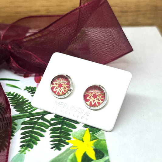 Red and rose gold glass dome snowflake studs.