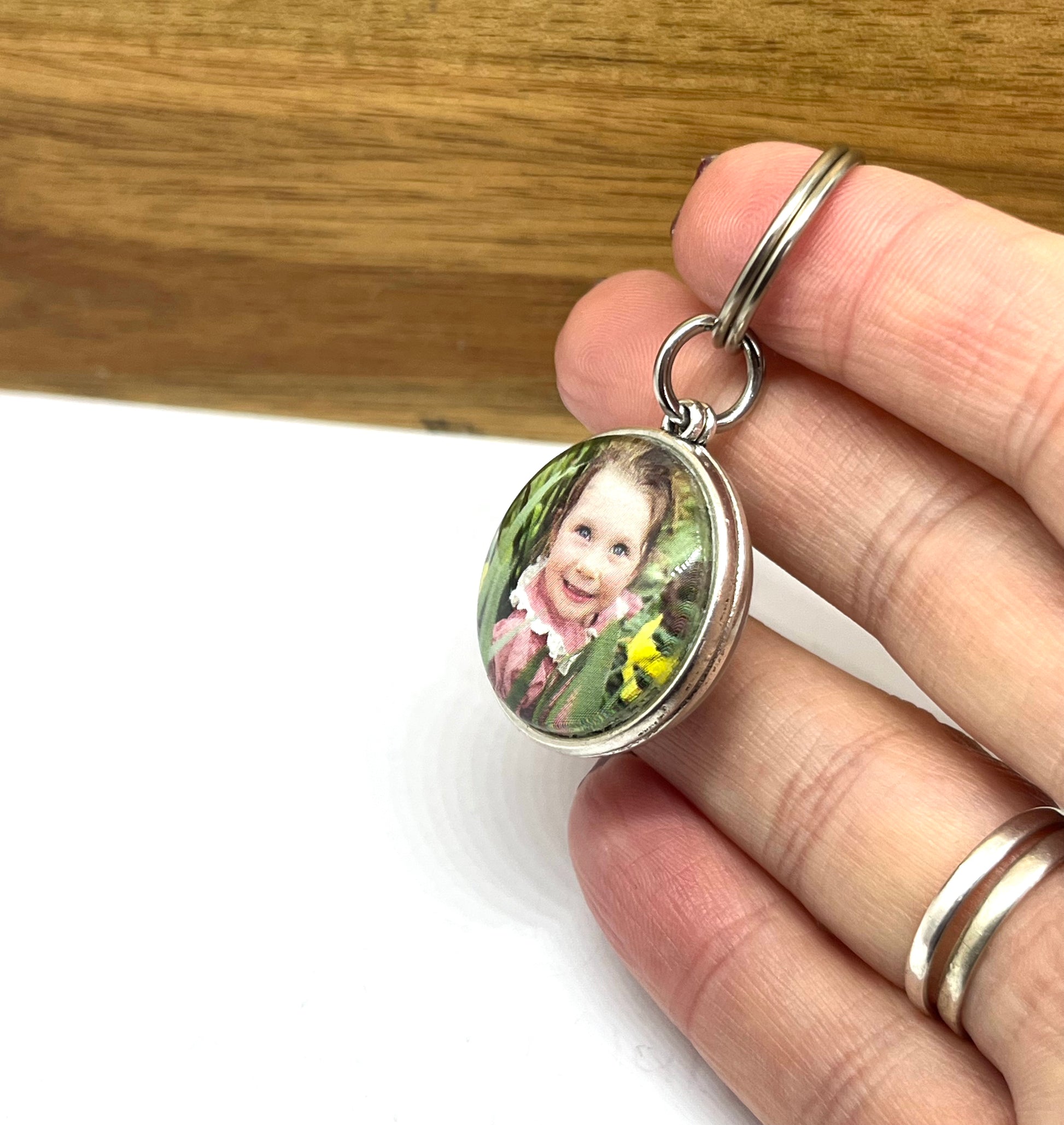 Photo of a little girl in a keyring.