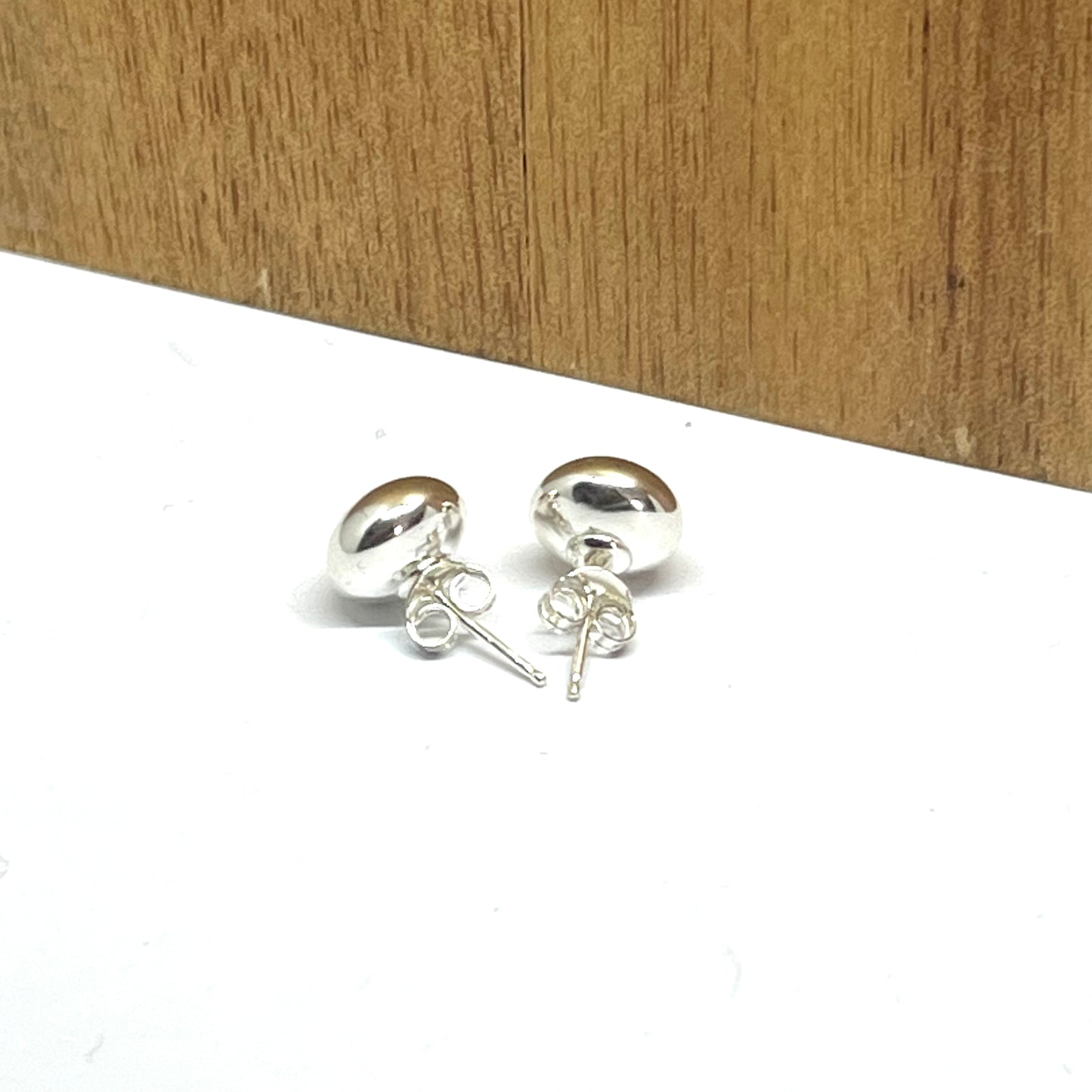 Sterling silver flat head 9mm studs with butterfly backs