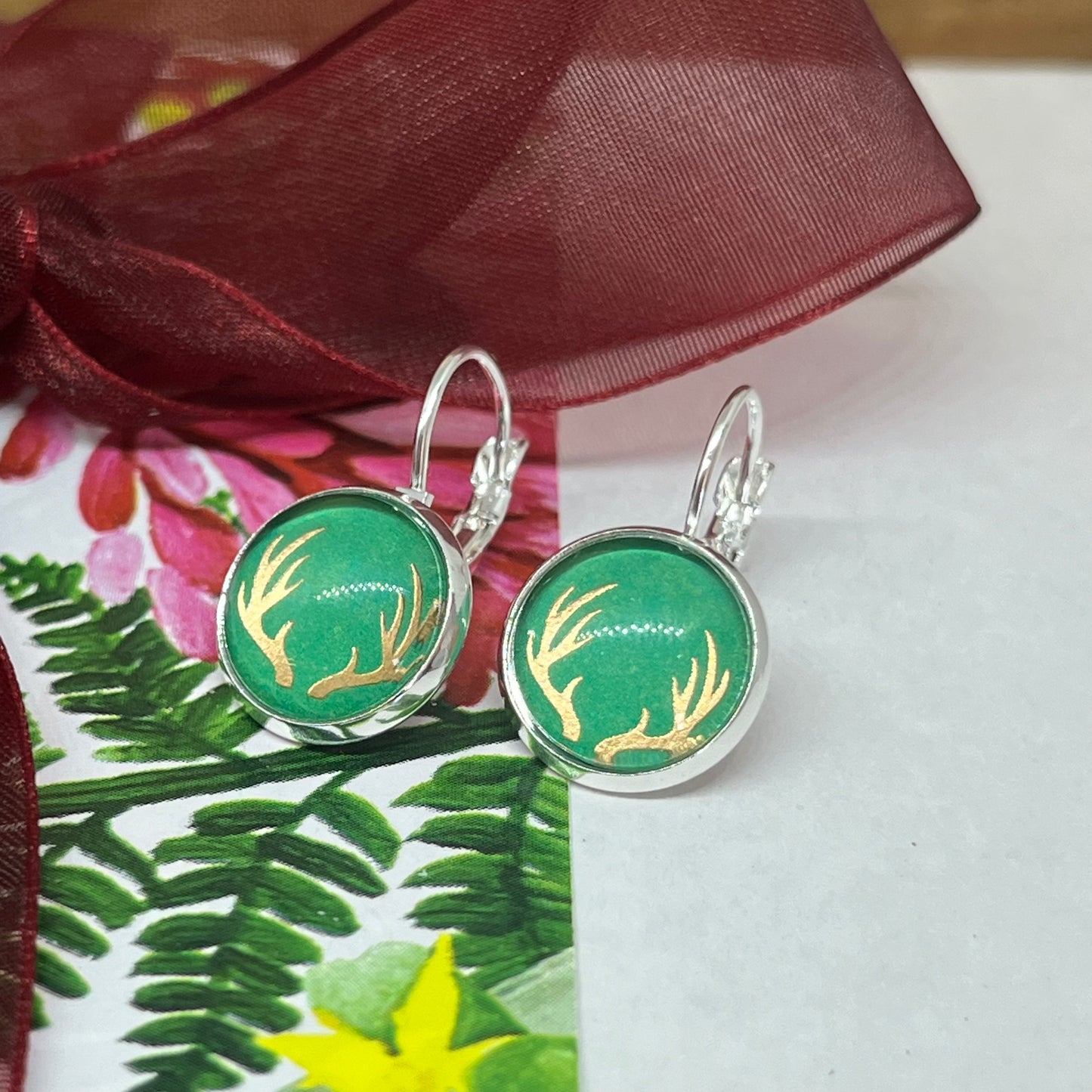 Green and rose gold glass dome reindeer christmas earrings