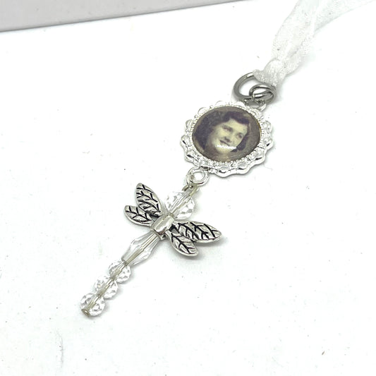 Glass Dragonfly hung on a silver setting with a photo set under glass 