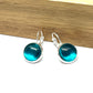Metallic Aqua blue glass dome earrings in a silver setting