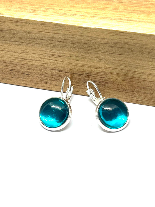 Metallic Aqua blue glass dome earrings in a silver setting