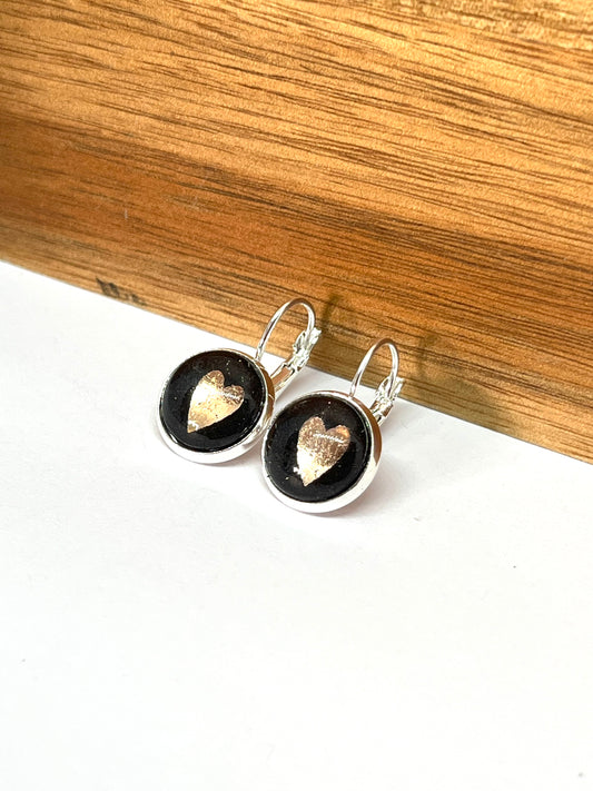 Rose gold hearts on a black background glass dome earrings