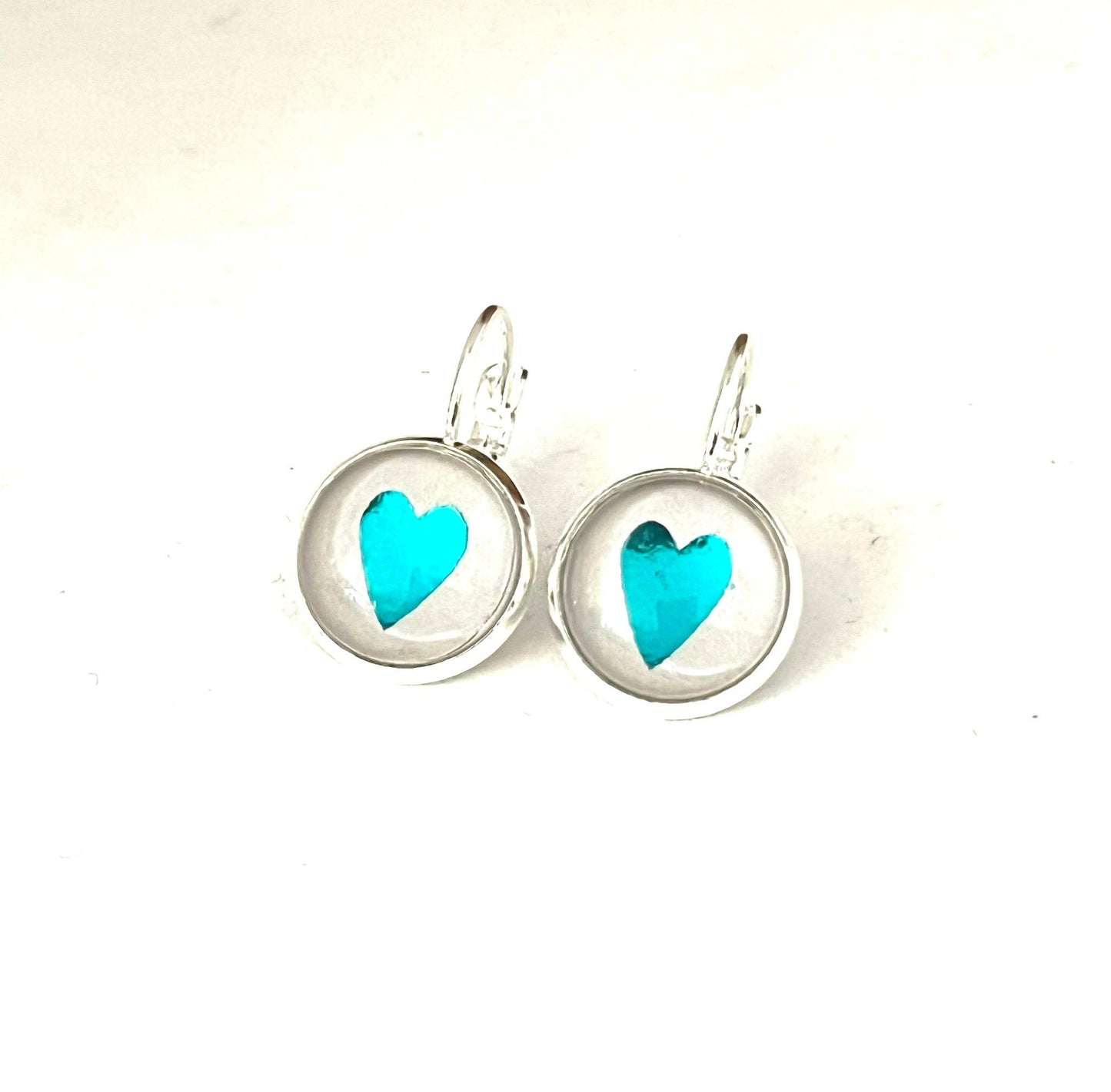 Beauitful Aqua blue heart glass dome earrings in a silver setting