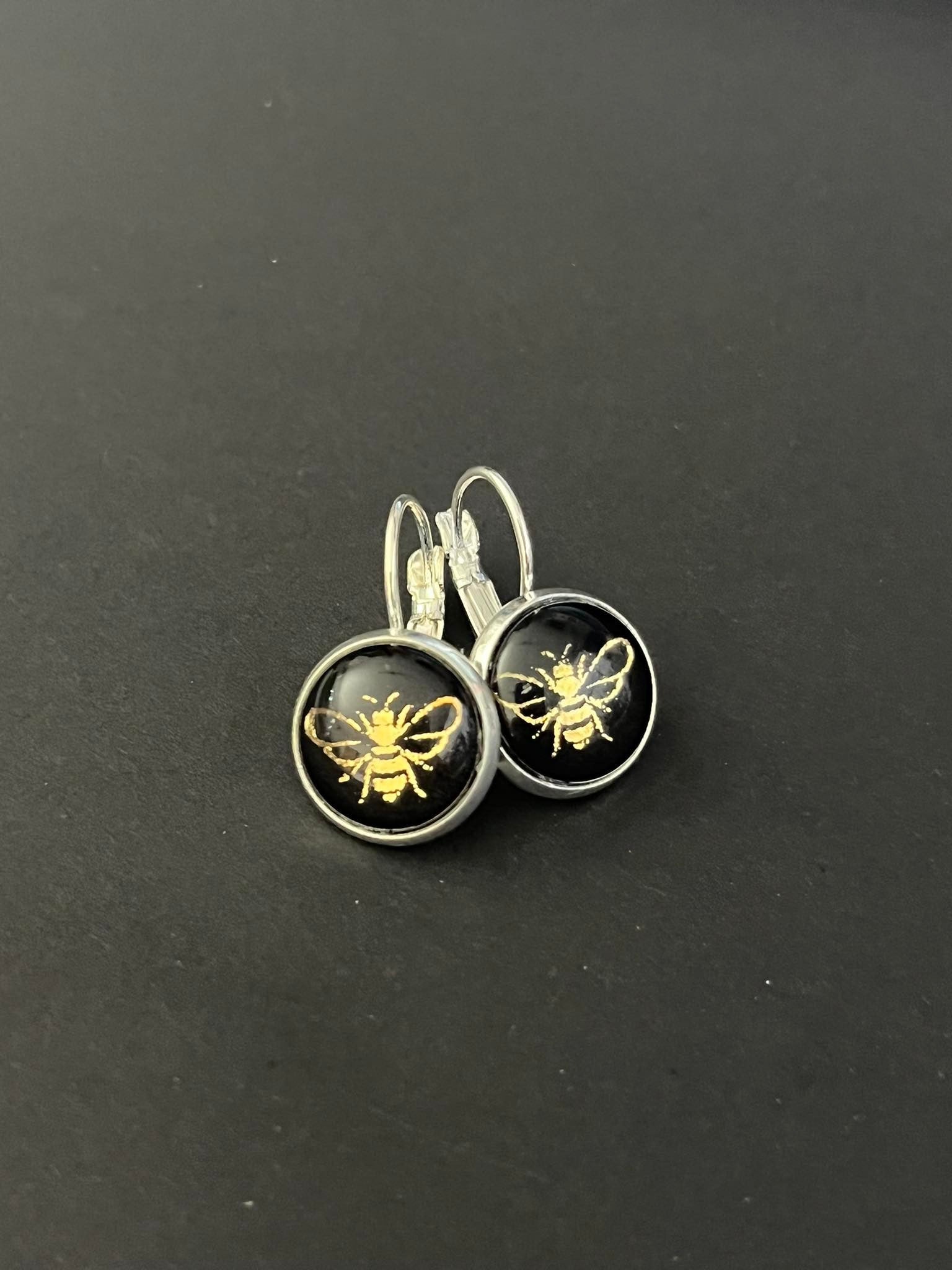 Stylish Gold bees on black glass dome earrings 