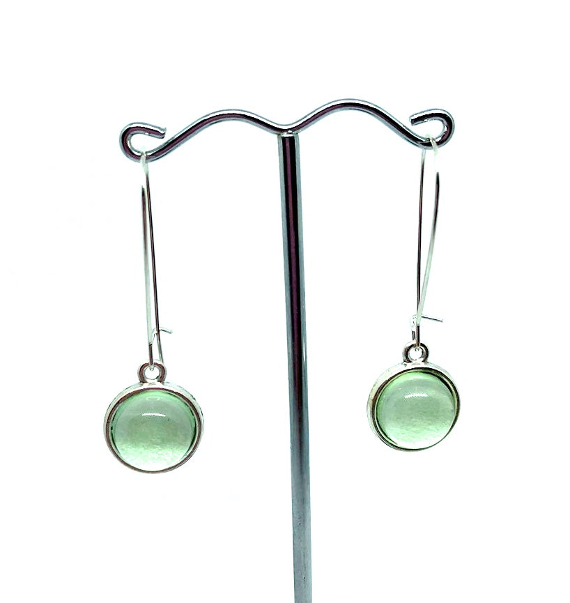Double sided glass dome earrings with soft green balls