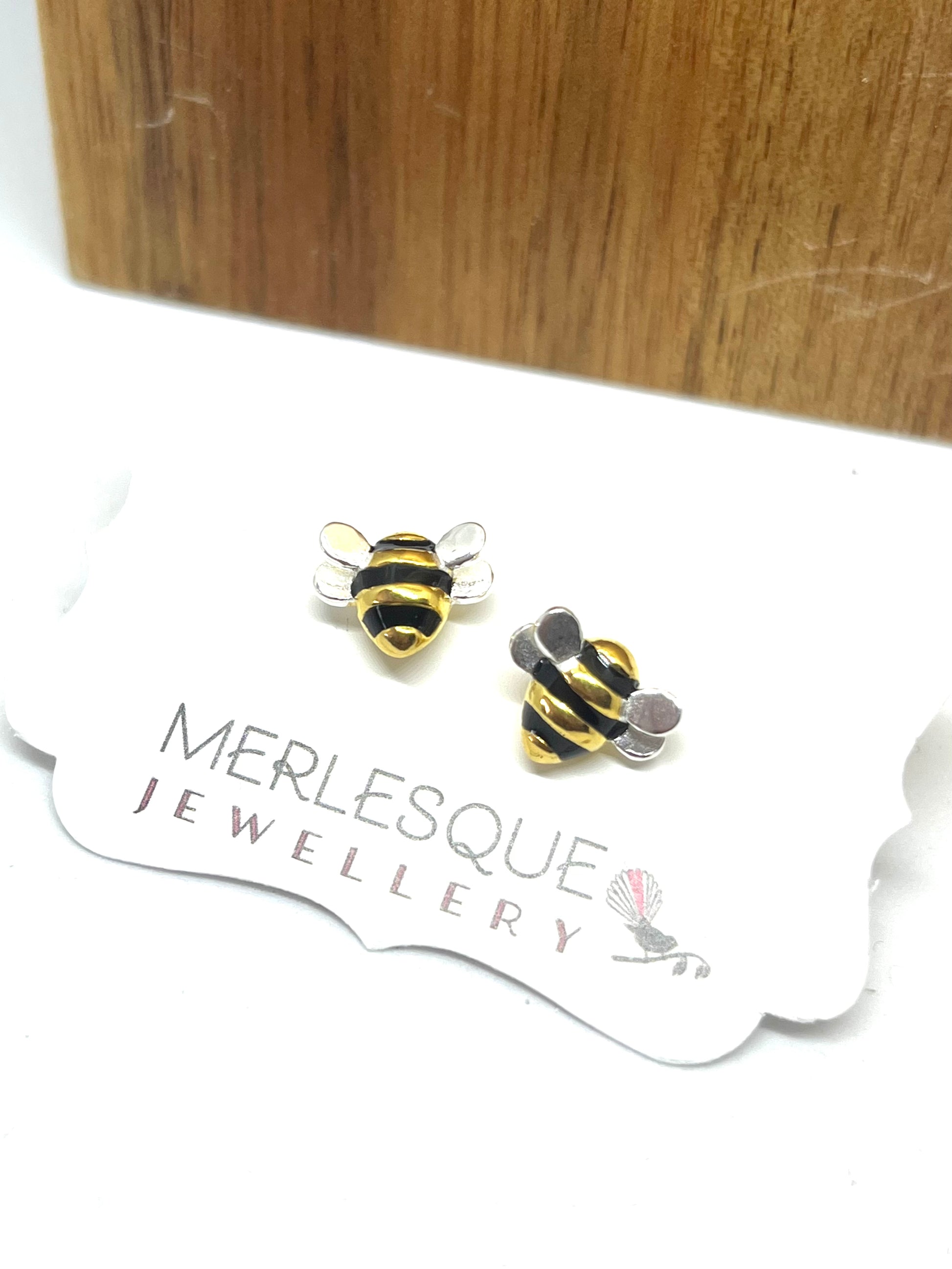 Cute bee studs in gold black and silver sterling metal.