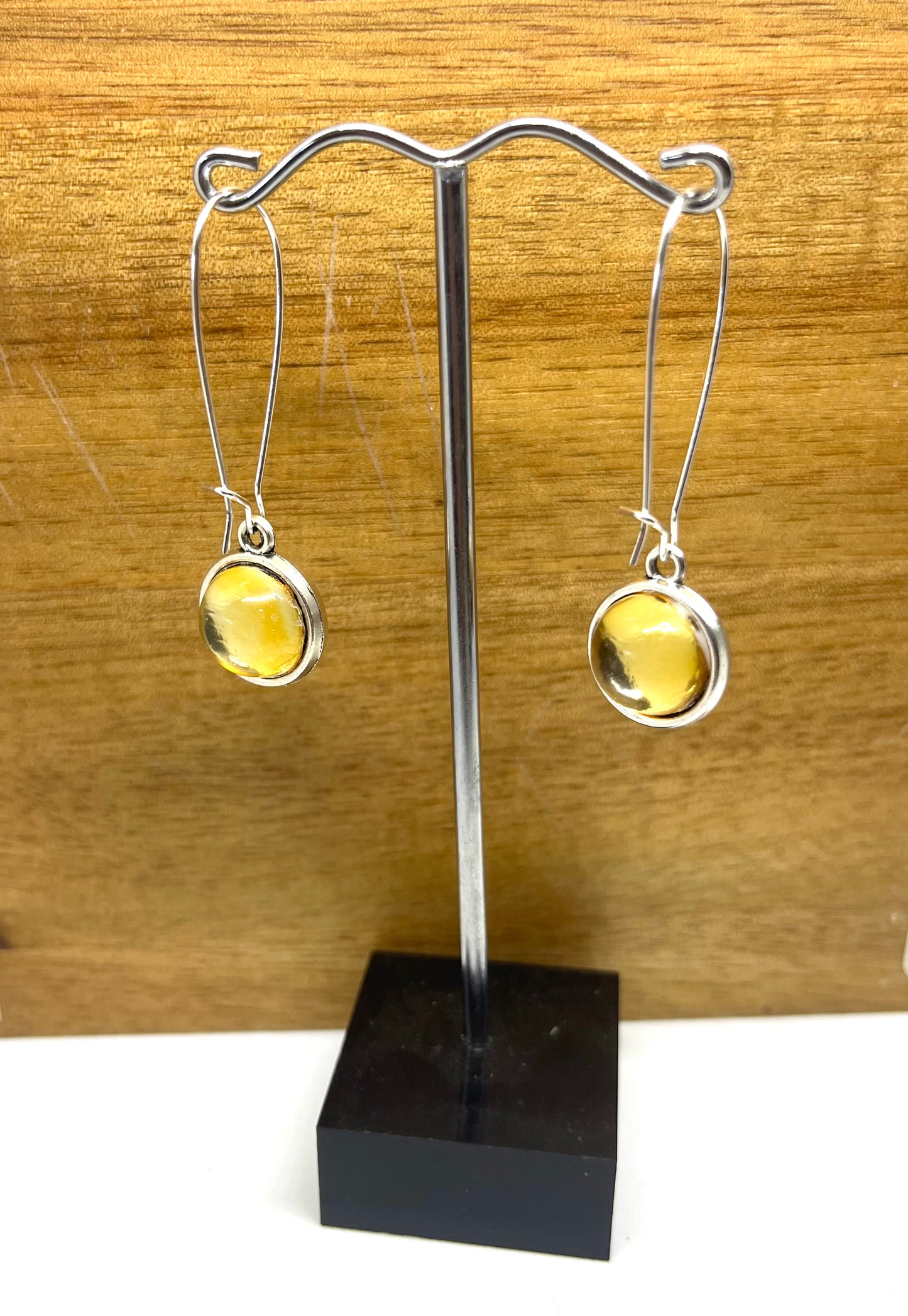 Double sided glass dome earrings with silver metallic and gold other side