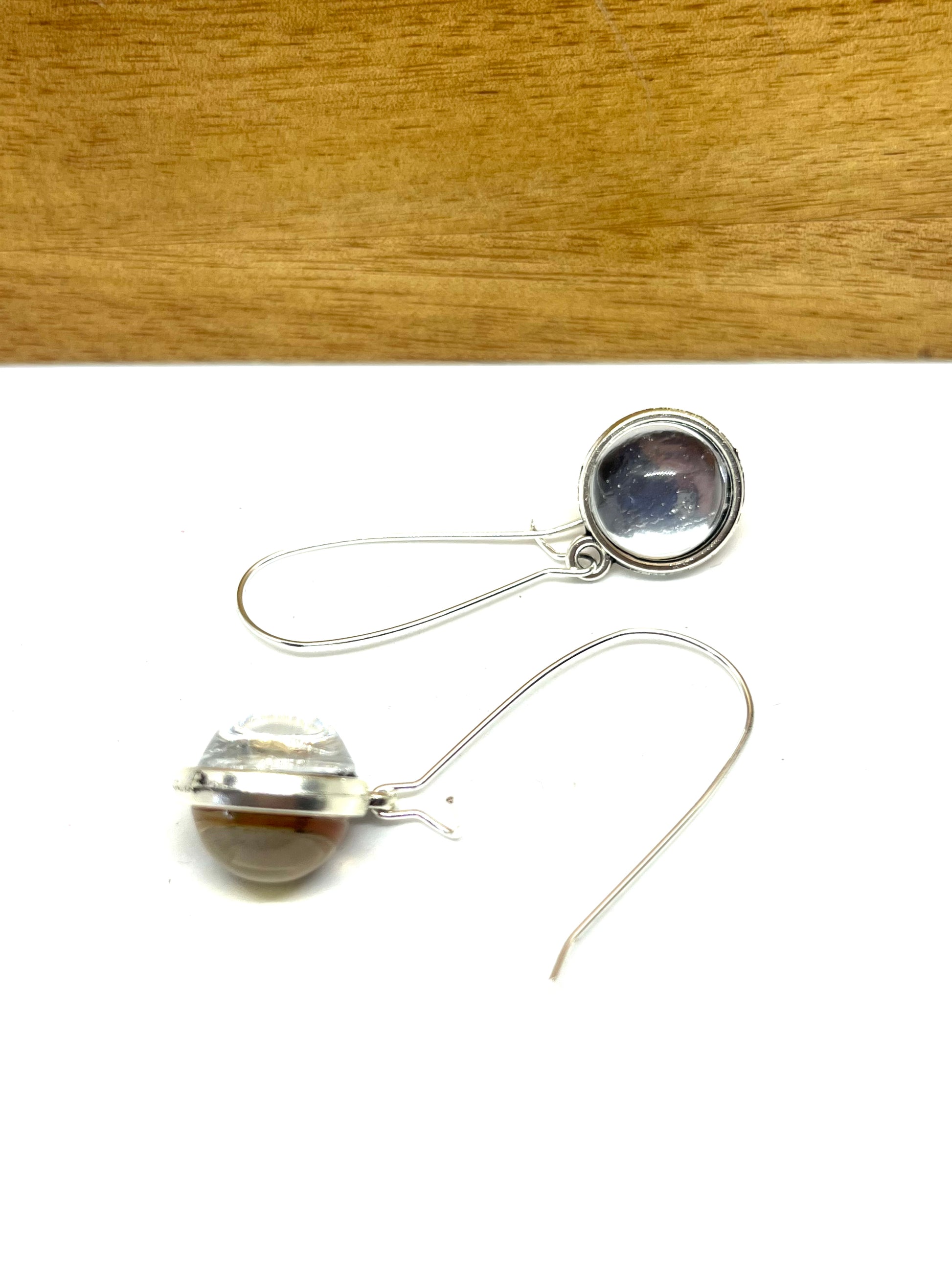 Double sided glass dome earrings with silver metallic and gold other side