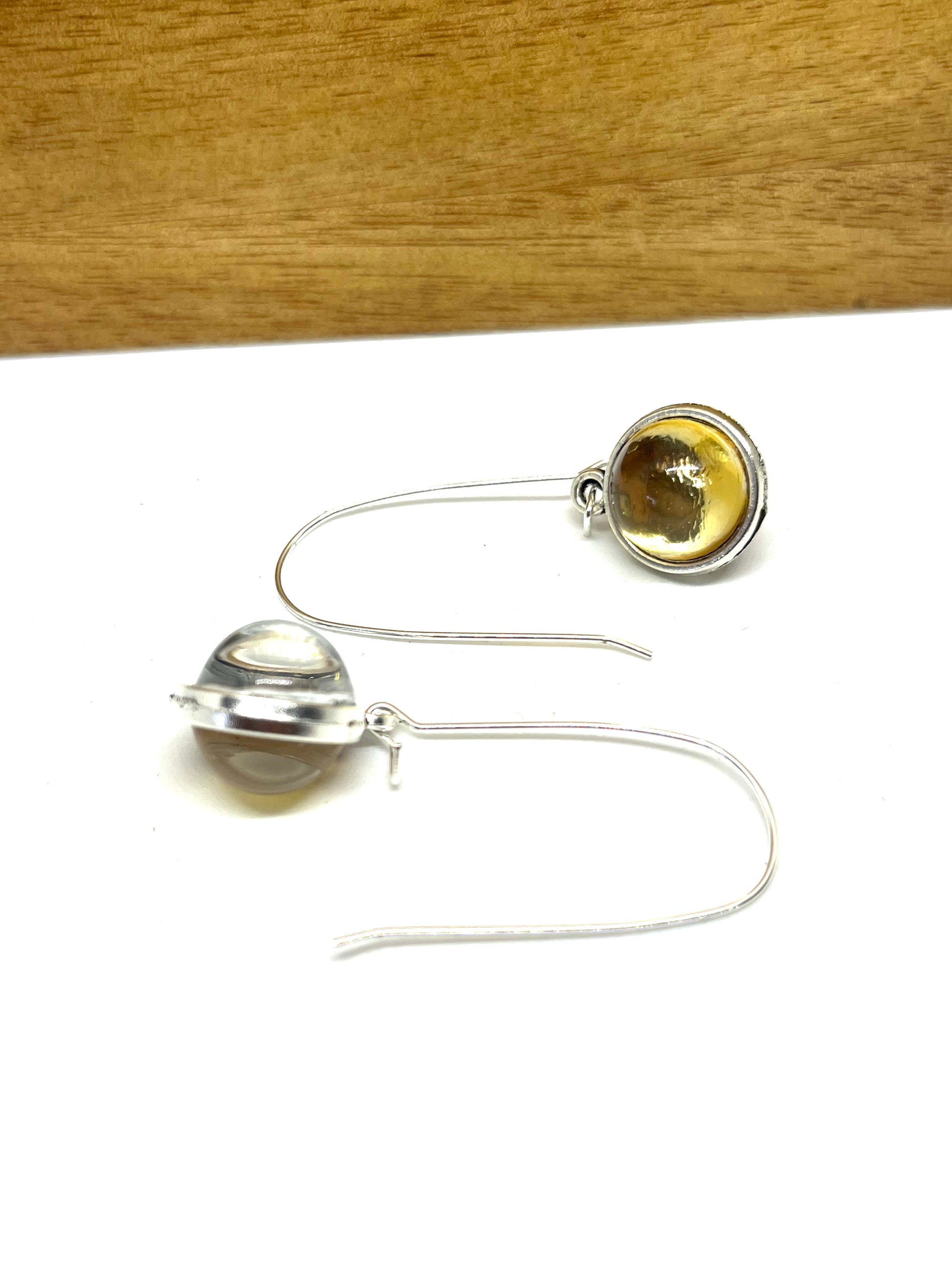 Double sided glass dome earrings with silver metallic and gold other side