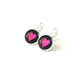 Hot pink hearts on a black background glass dome earrings 