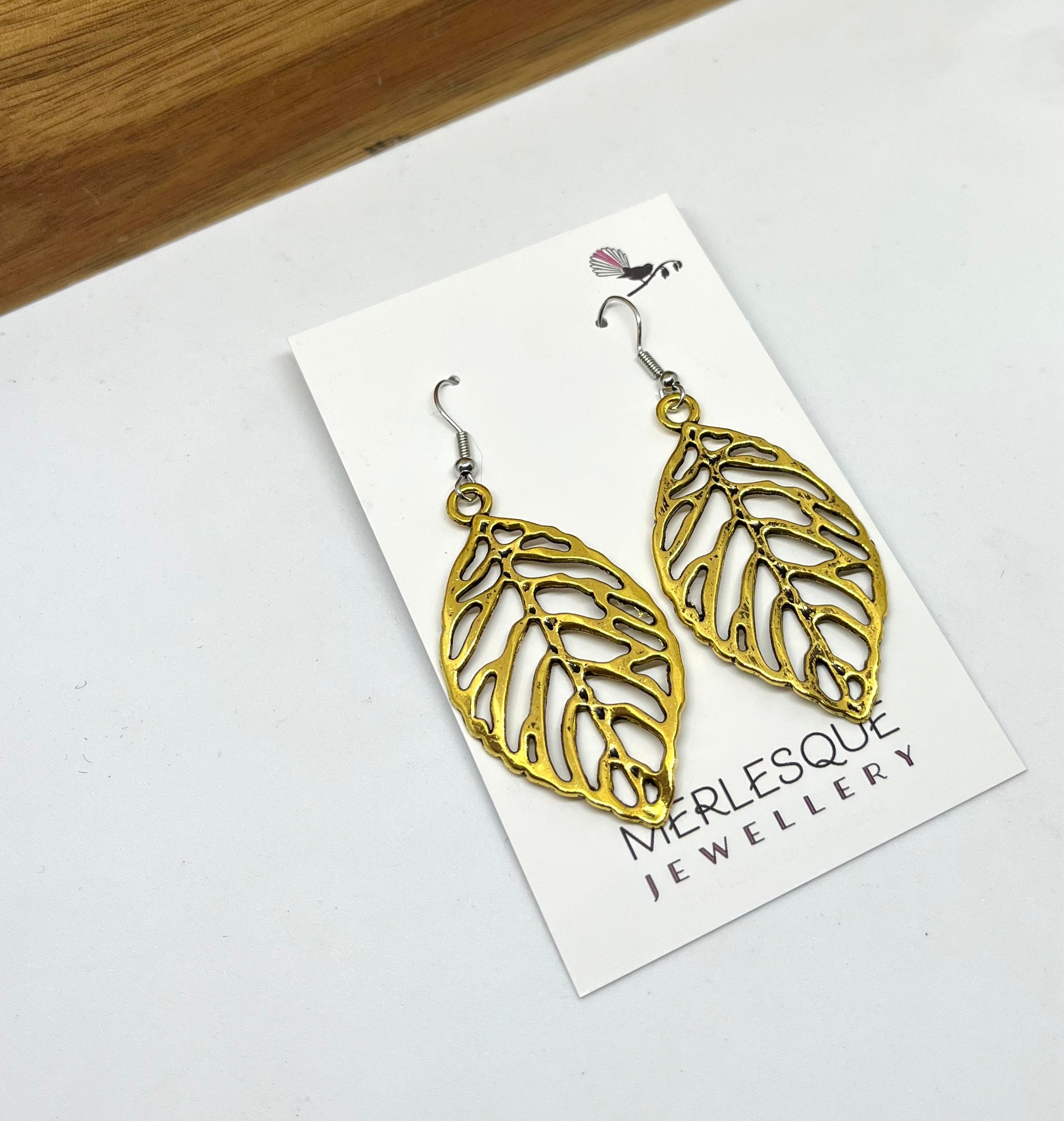 Long gold 2025 leaf earrings